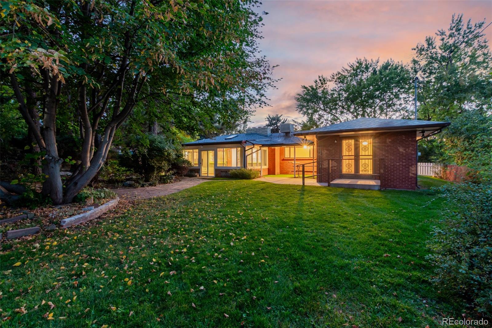 3880 Independence Court Wheat Ridge, CO 80033 - Photo 45 of 47 a front view of a house with a yard