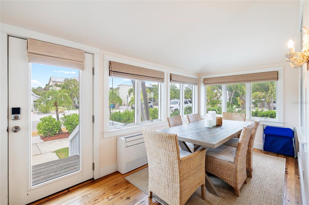 340 Palm Avenue Boca Grande, FL 33921 - Photo 7 of 38 a view of a dining room with furniture window and wooden floor