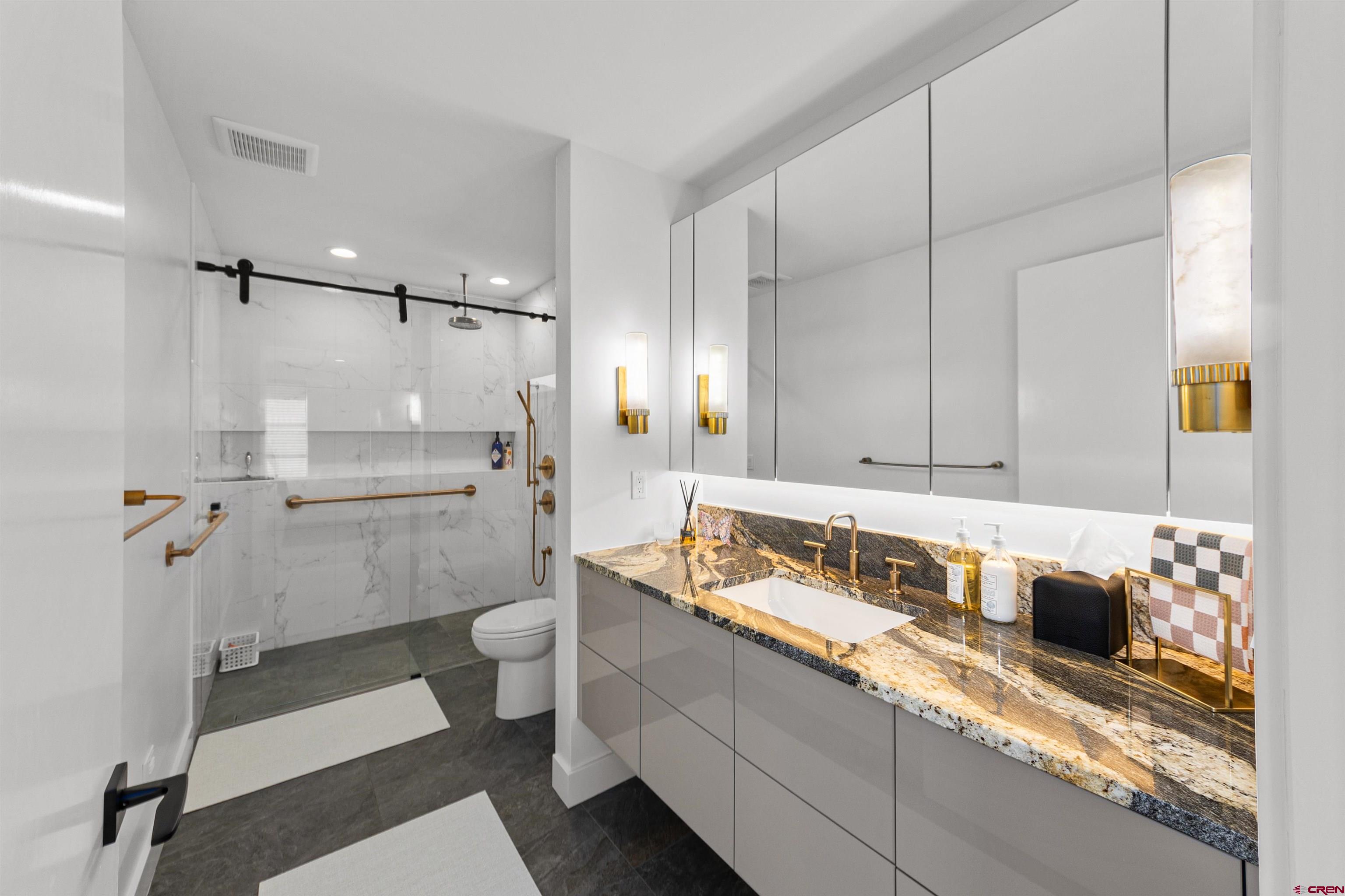 12 Falcon Way Durango, CO 81301 - Photo 21 of 38 a bathroom with a sink a toilet and shower