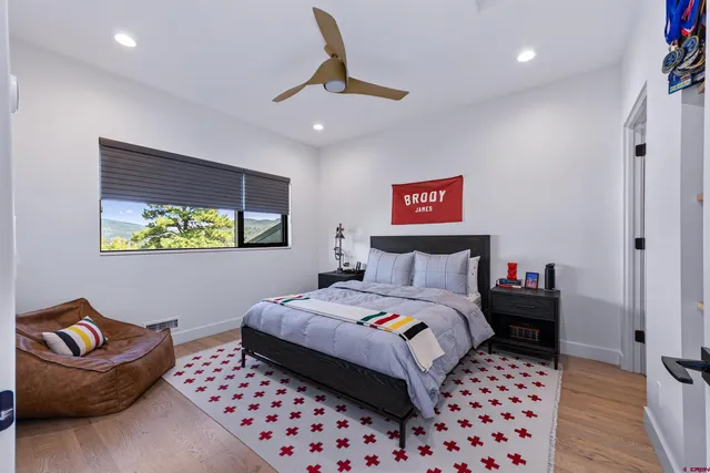 a bedroom with a bed and a couch