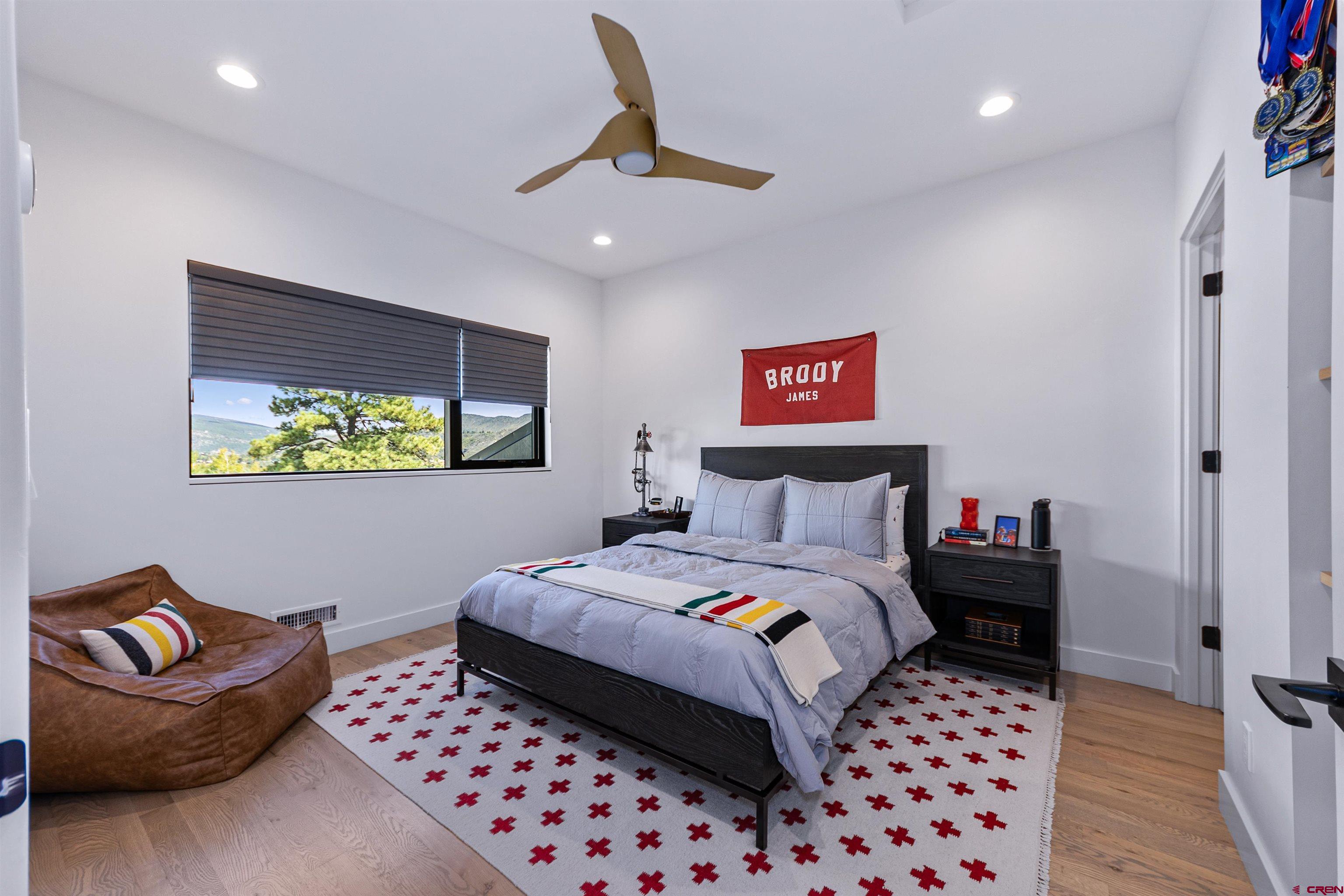 12 Falcon Way Durango, CO 81301 - Photo 23 of 38 a bedroom with a bed and a couch