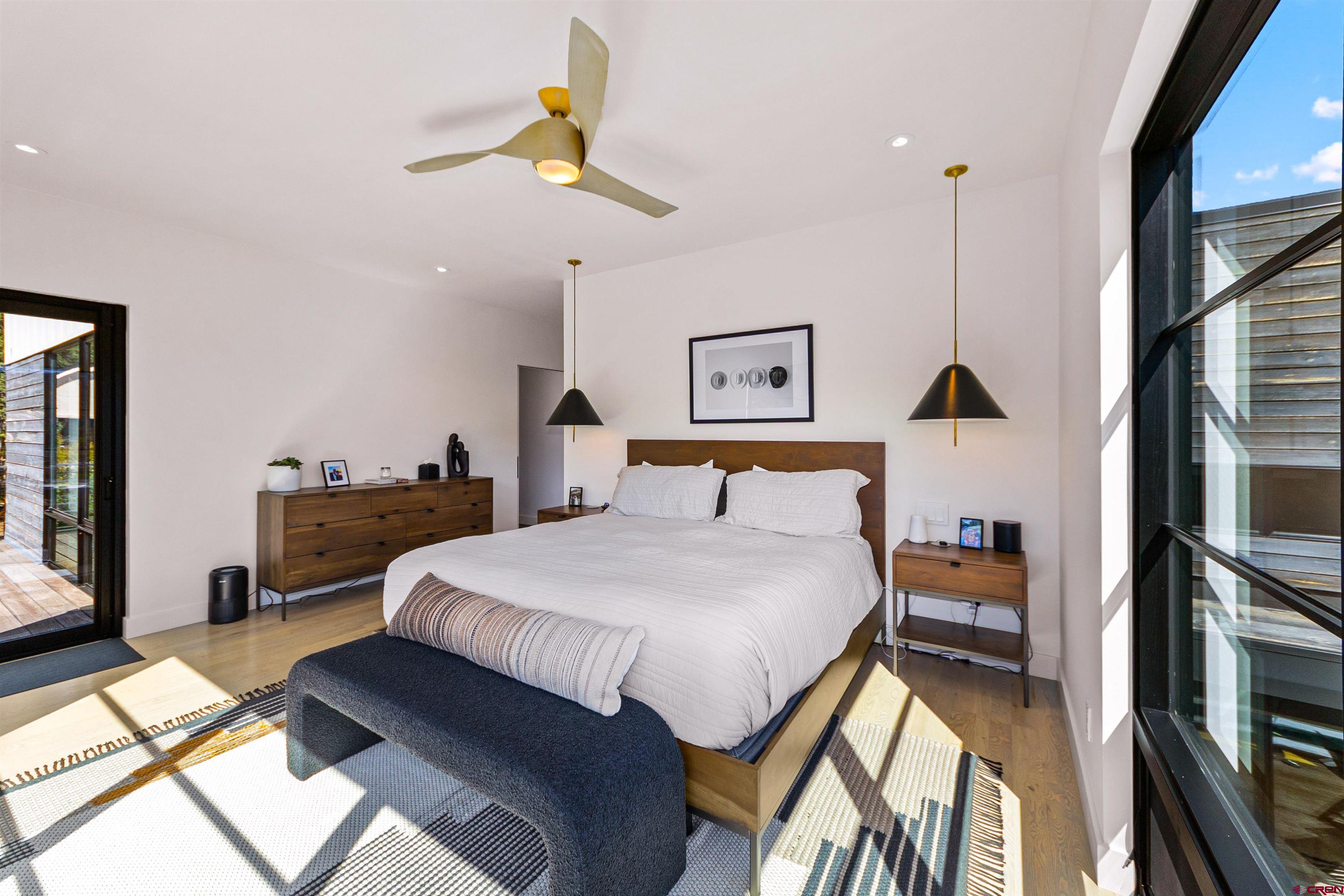 12 Falcon Way Durango, CO 81301 - Photo 27 of 38 a bedroom with a bed and a flat tv screen on dresser