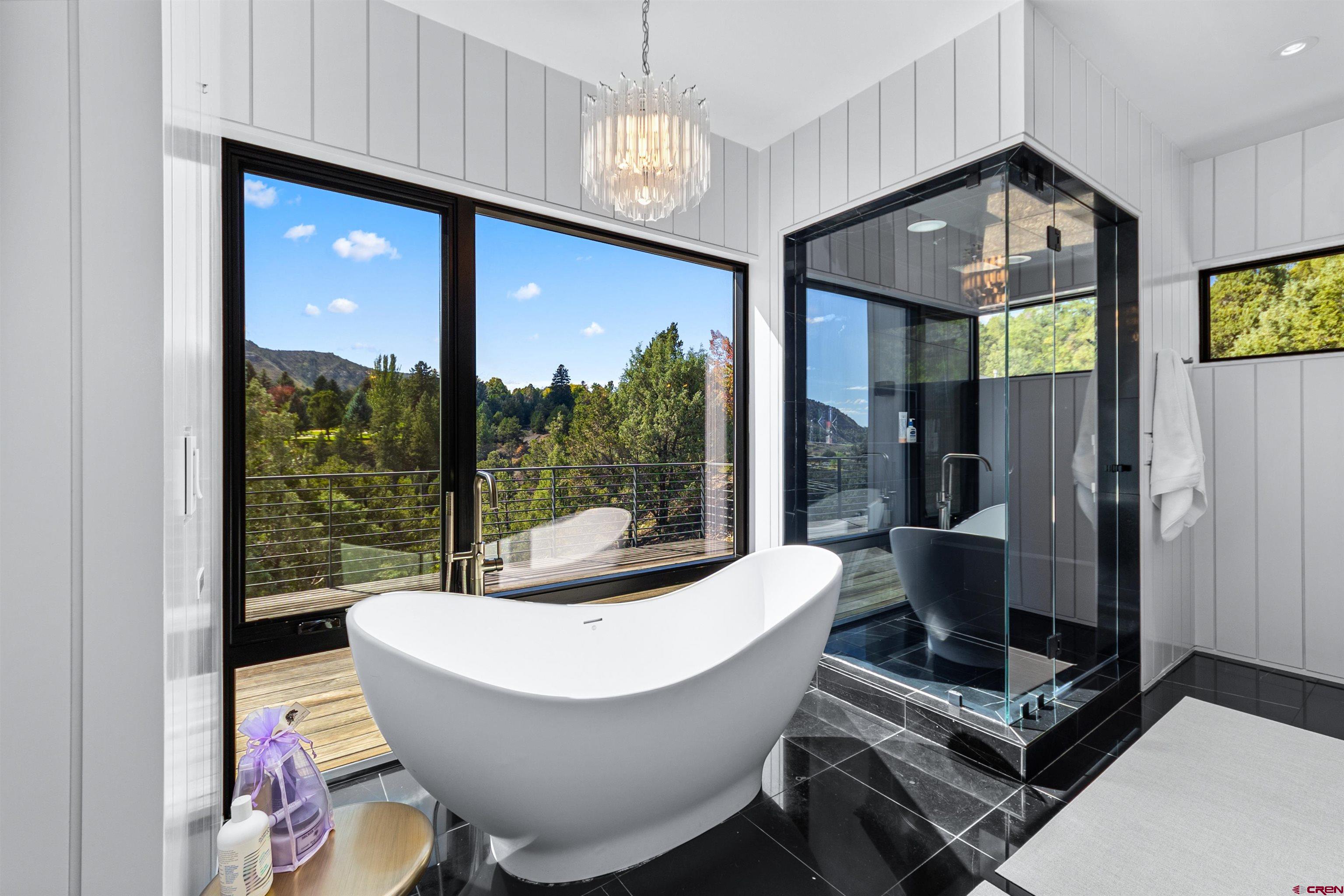12 Falcon Way Durango, CO 81301 - Photo 30 of 38 a living room with furniture and a floor to ceiling window