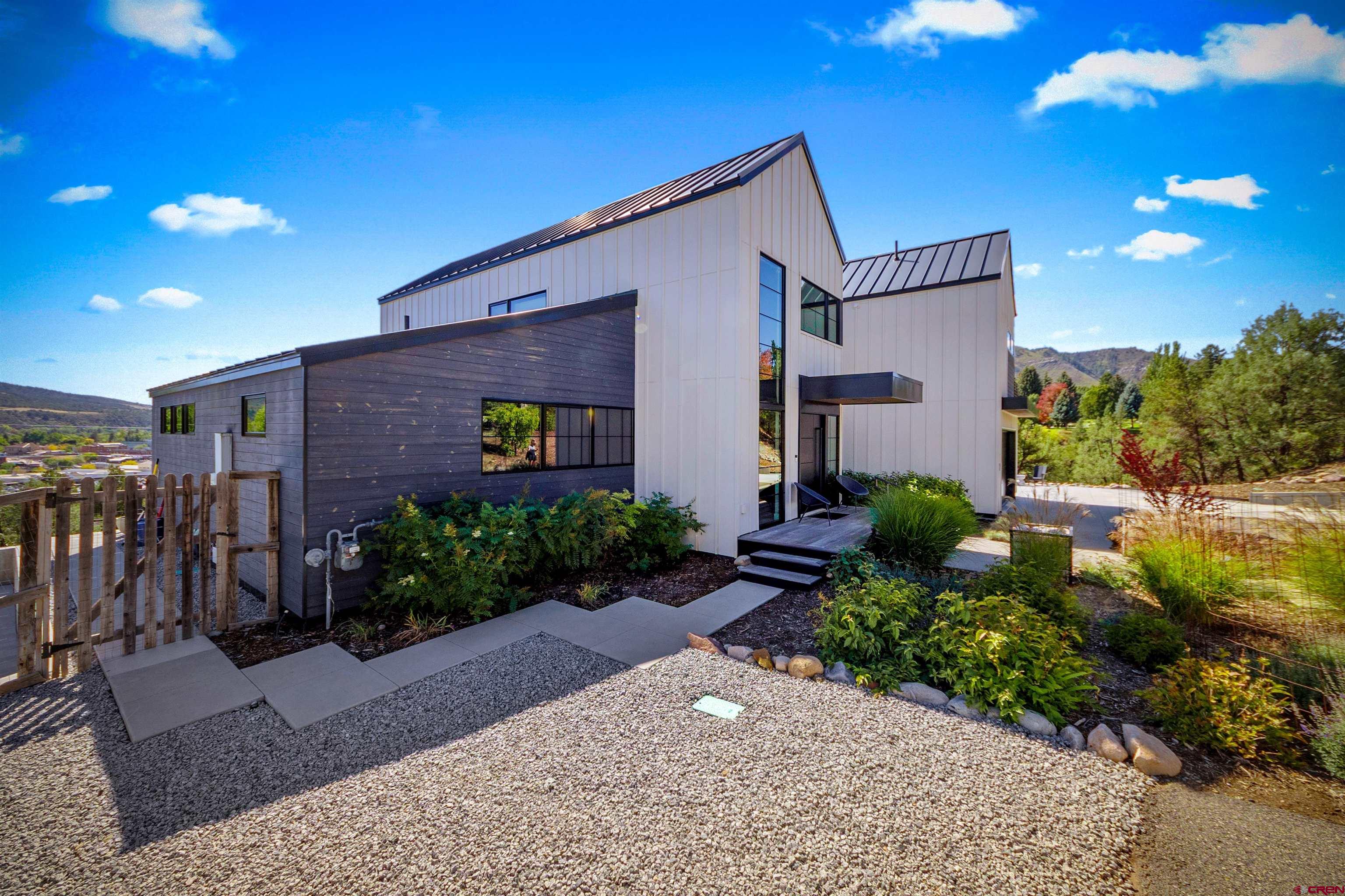 12 Falcon Way Durango, CO 81301 - Photo 3 of 38 a front view of a house with garden