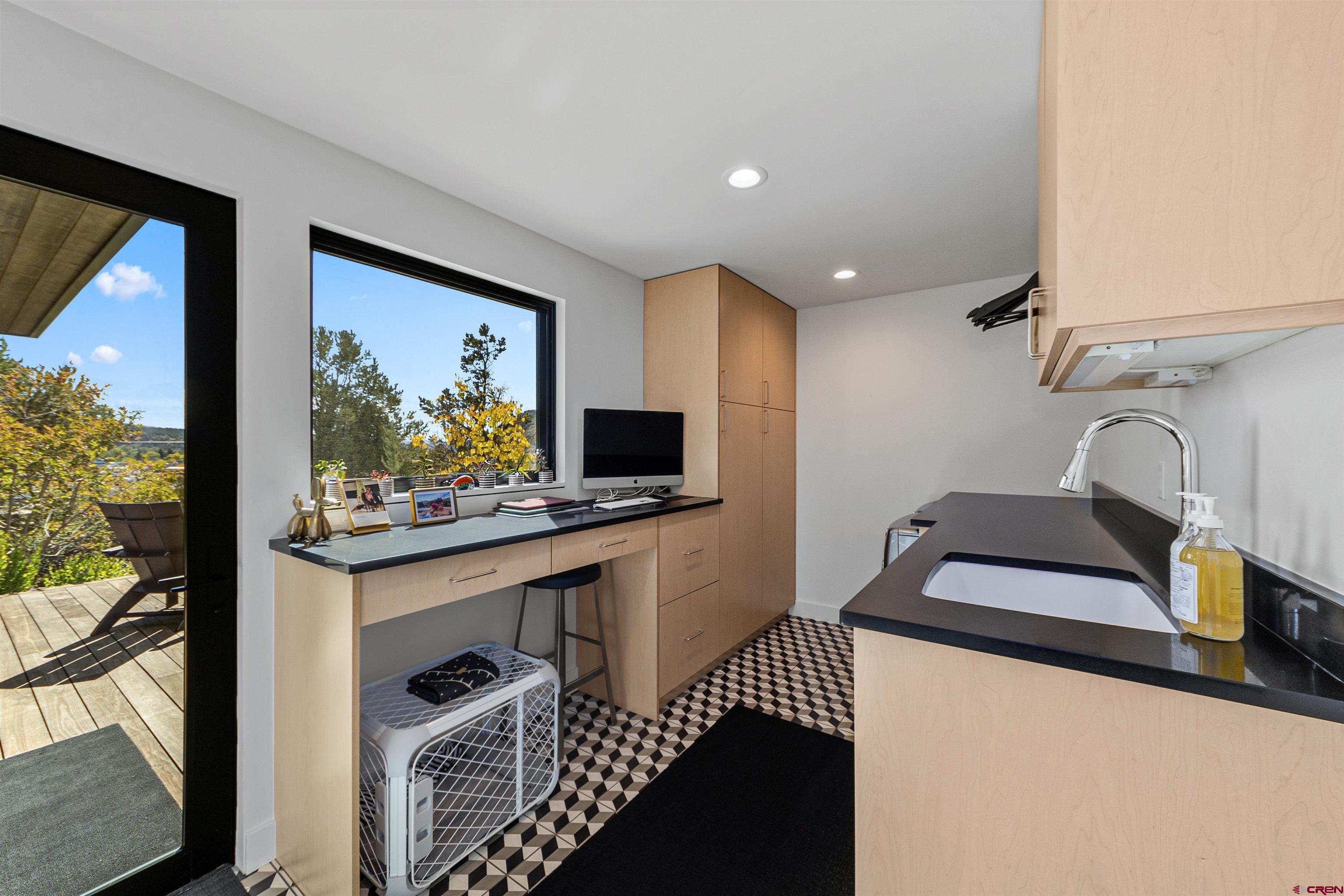 12 Falcon Way Durango, CO 81301 - Photo 32 of 38 a living room with furniture and a flat screen tv