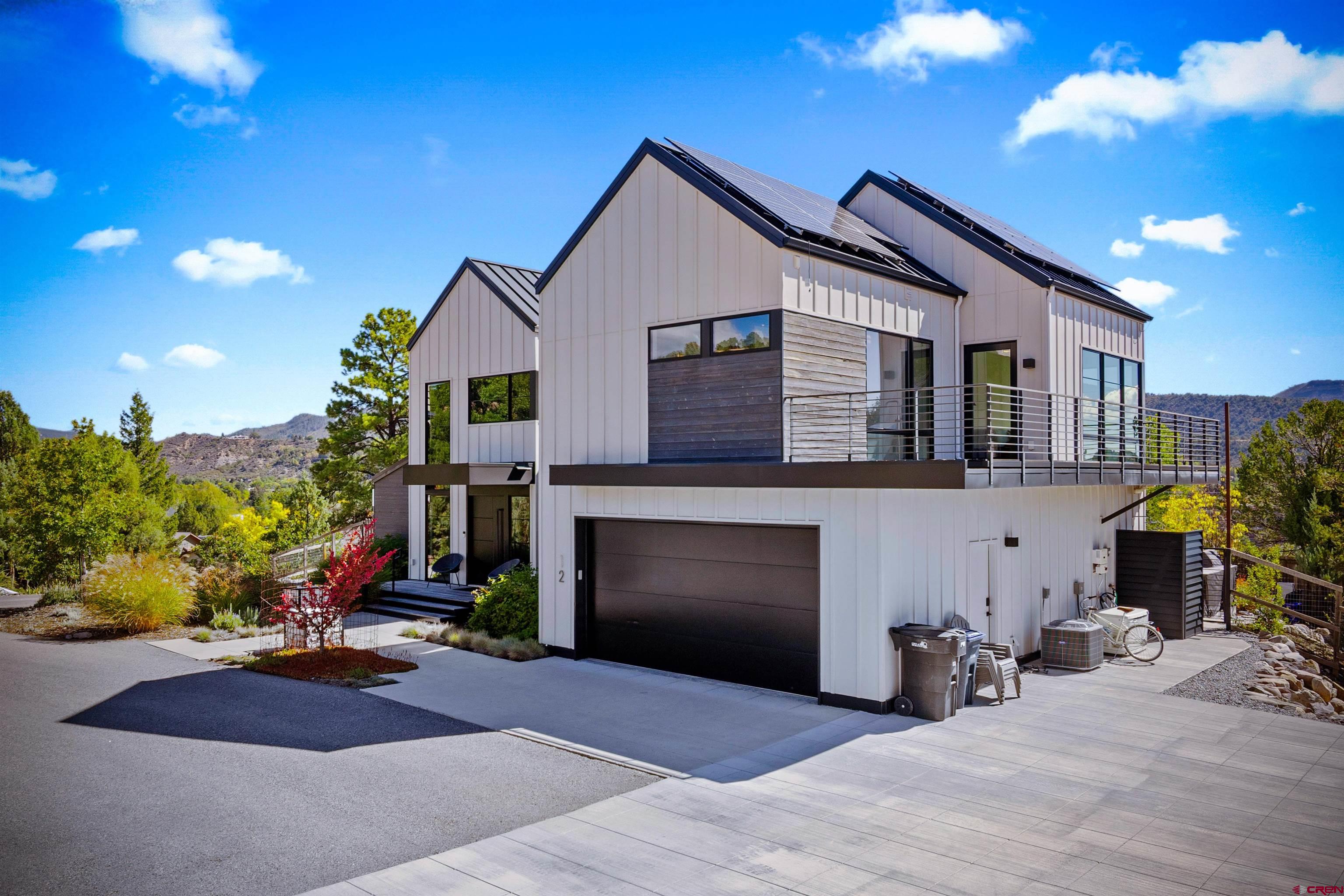12 Falcon Way Durango, CO 81301 - Photo 6 of 38 a front view of a house with yard and seating area
