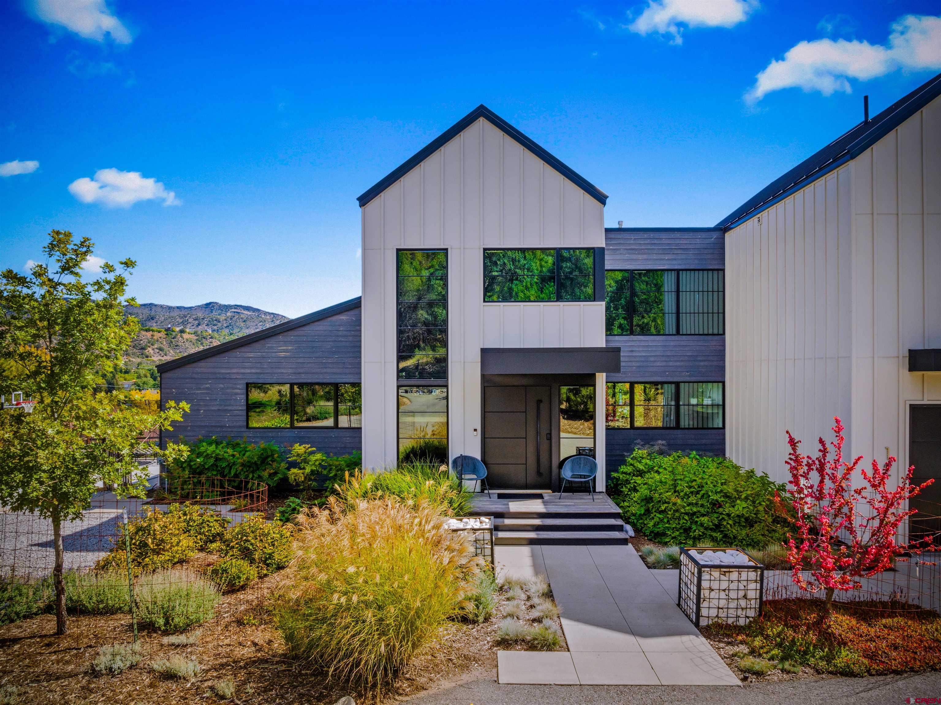 12 Falcon Way Durango, CO 81301 - Photo 7 of 38 a front view of a house with potted plants