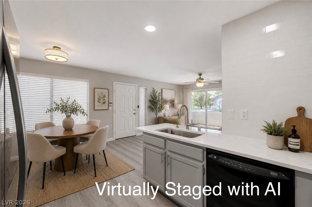 3425 East Russell Road, Unit 223 Las Vegas, NV 89120 - Photo 11 of 47 An inviting open-concept layout features a well-appointed kitchen flowing into a comfortable dining area.