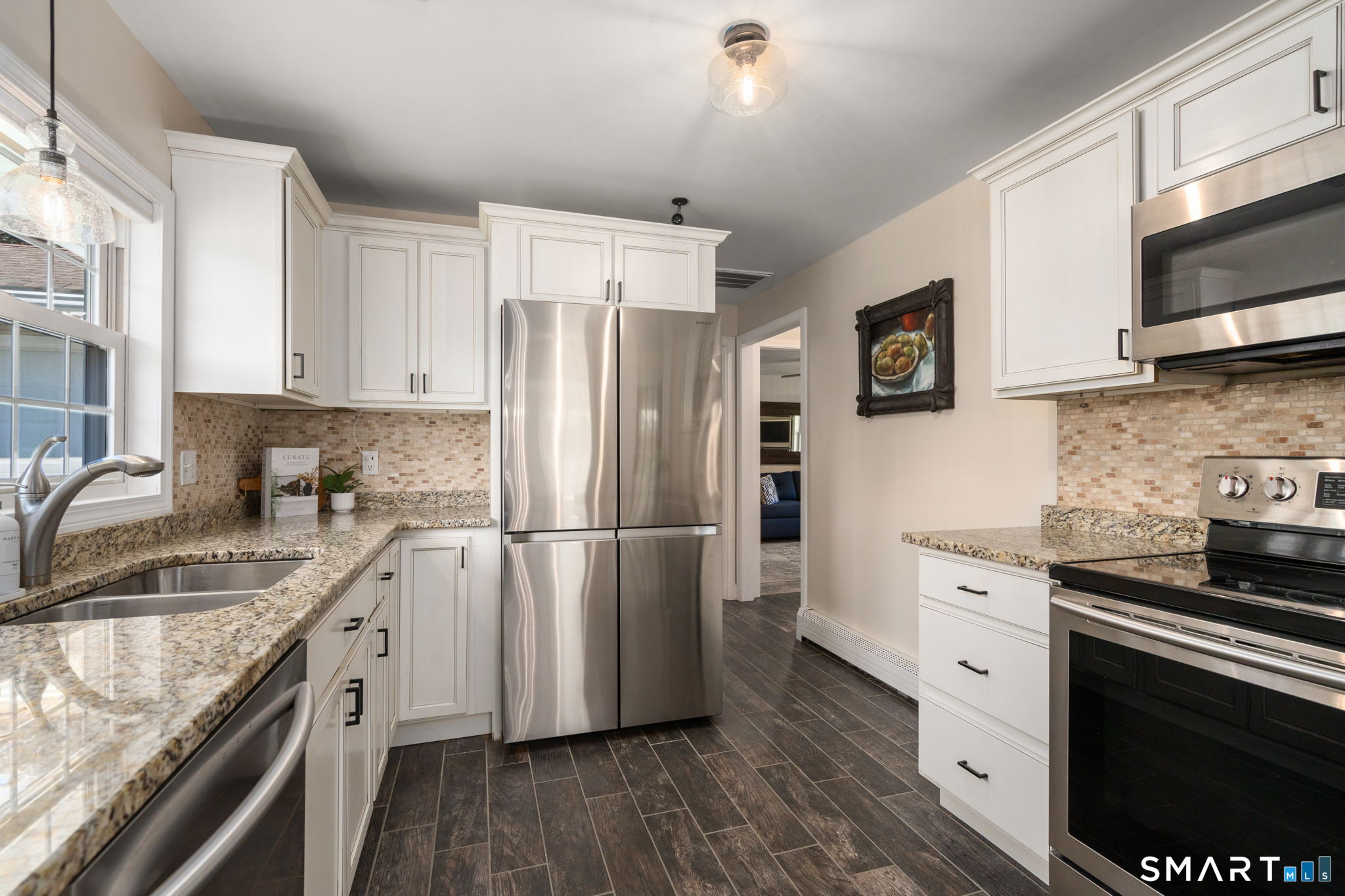 31 Cowan Street Suffield, CT 06078 - Photo 6 of 29 a kitchen with stainless steel appliances granite countertop a refrigerator stove and sink