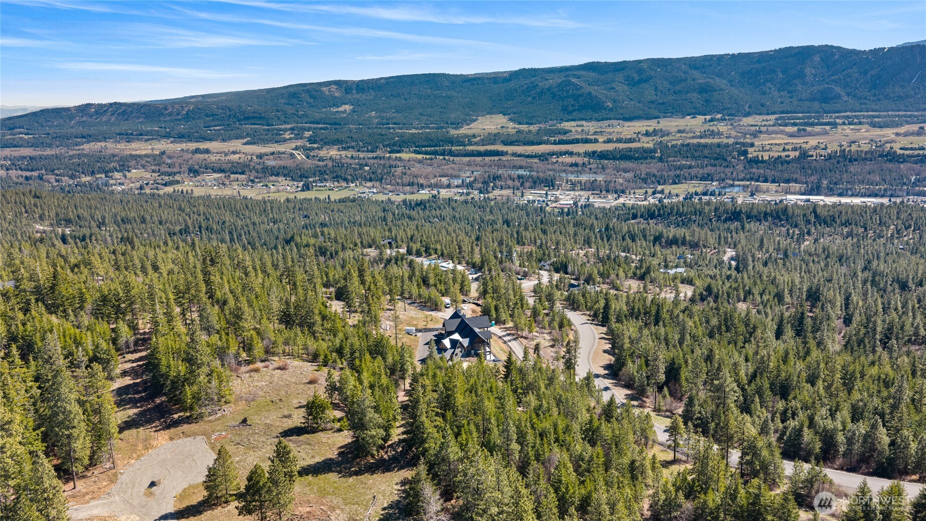 81 Forest Ridge Drive Cle Elum, WA 98922 - Photo 22 of 28 a view of a city with mountains in the background