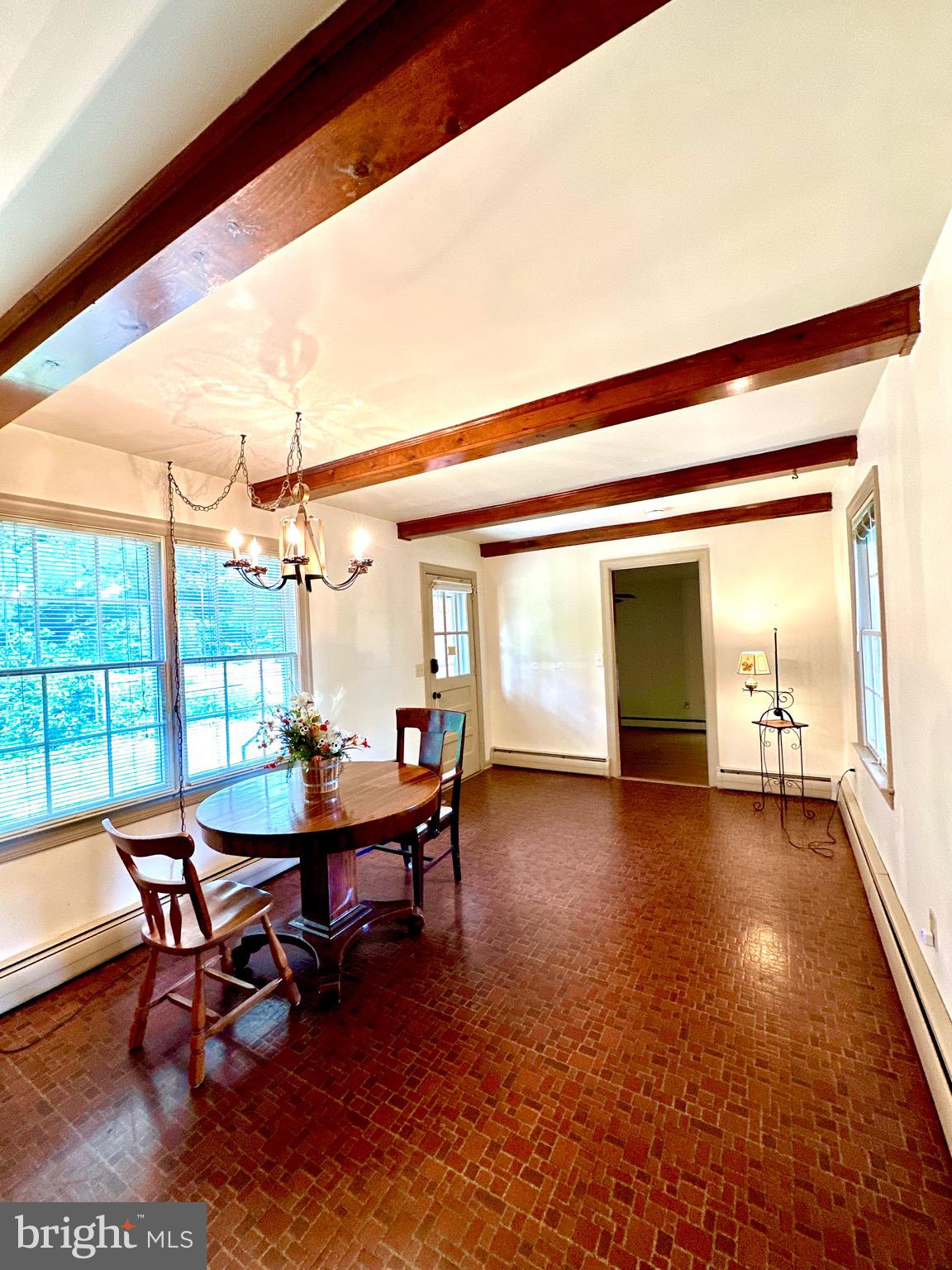 116 Main Street Townsend, DE 19734 - Photo 24 of 68 a view of a dining room with furniture window and wooden floor
