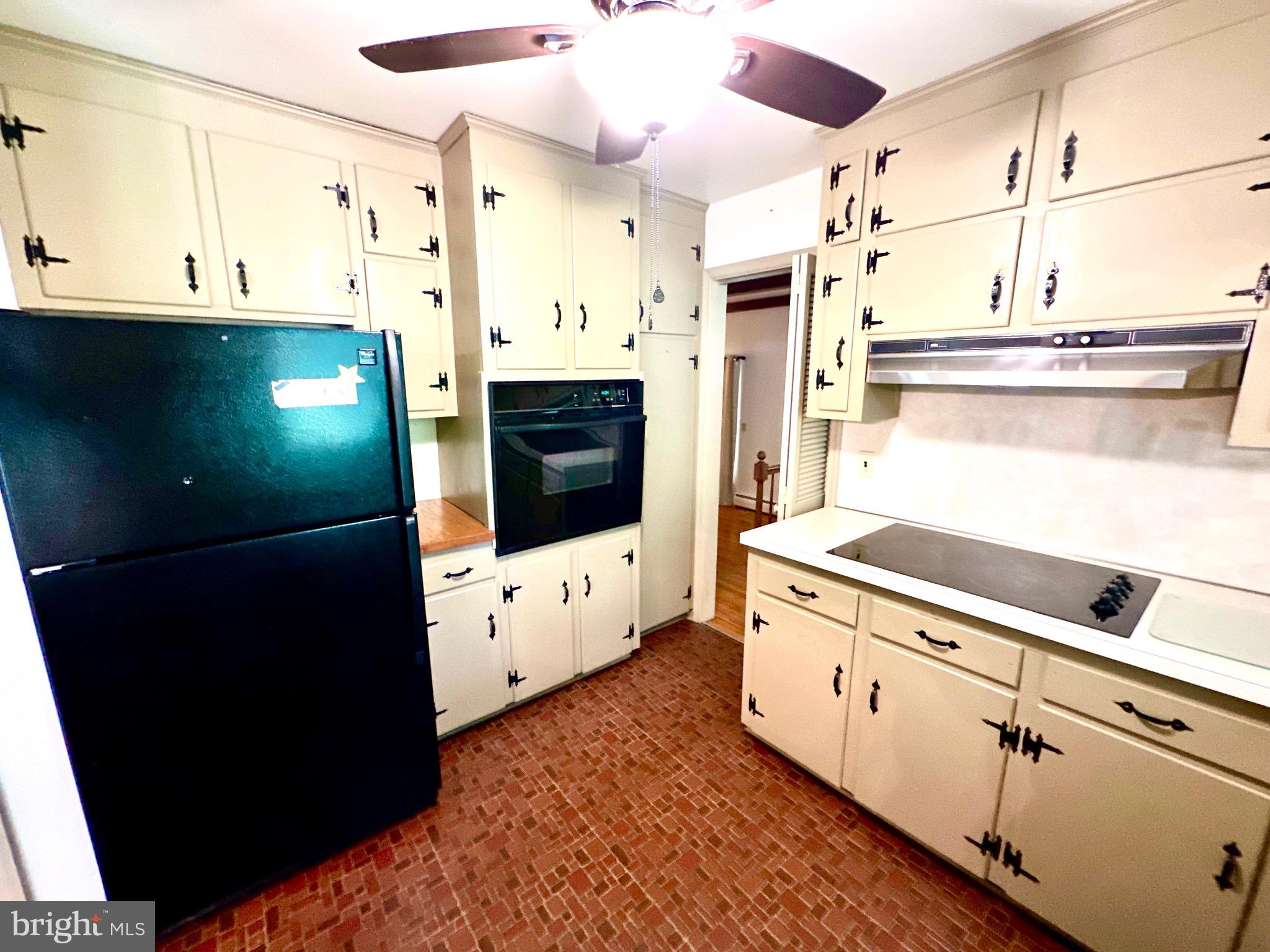 116 Main Street Townsend, DE 19734 - Photo 27 of 68 a kitchen with stainless steel appliances kitchen island granite countertop a refrigerator and a stove