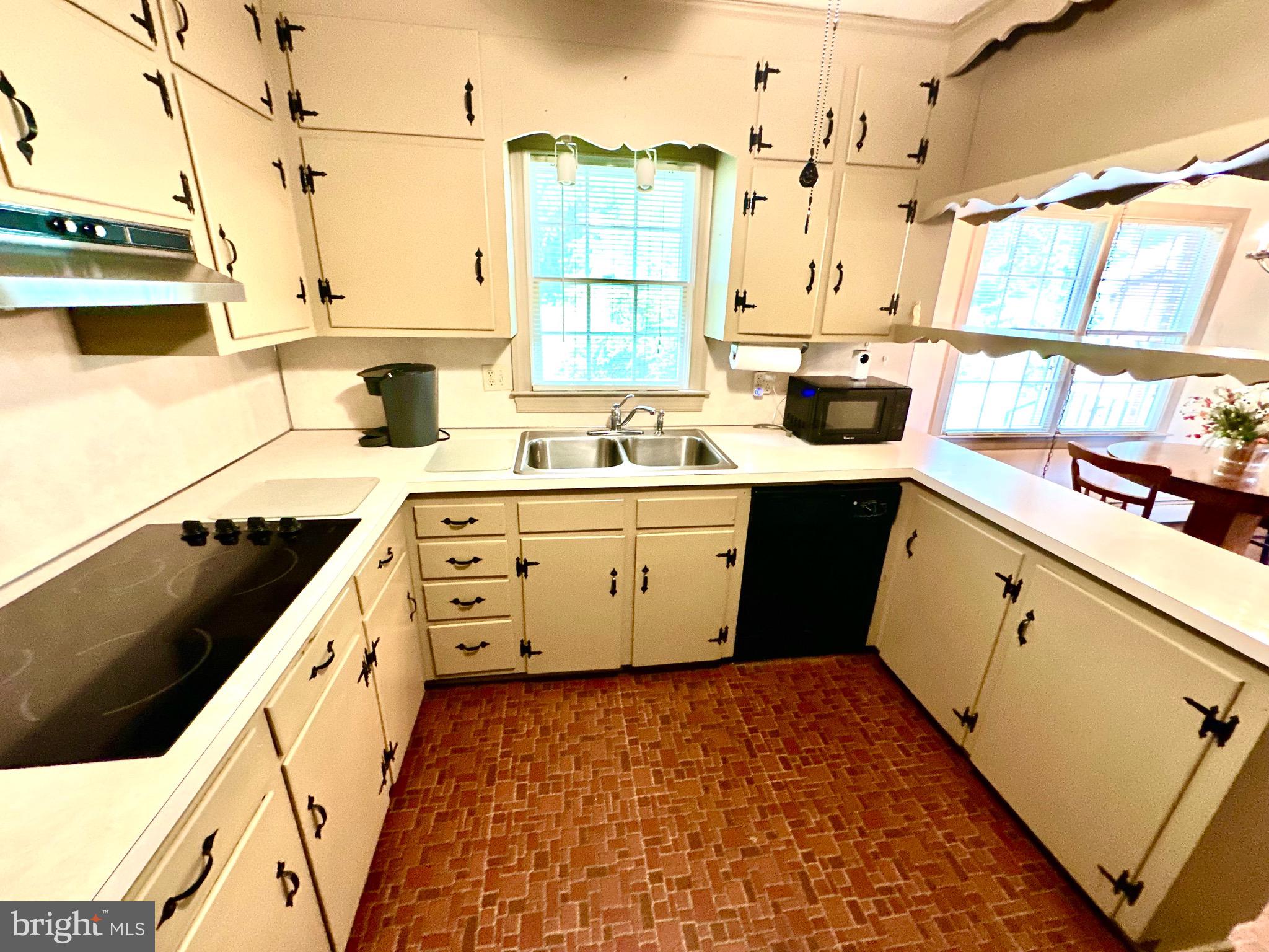 116 Main Street Townsend, DE 19734 - Photo 28 of 68 a kitchen with a sink stove and cabinets