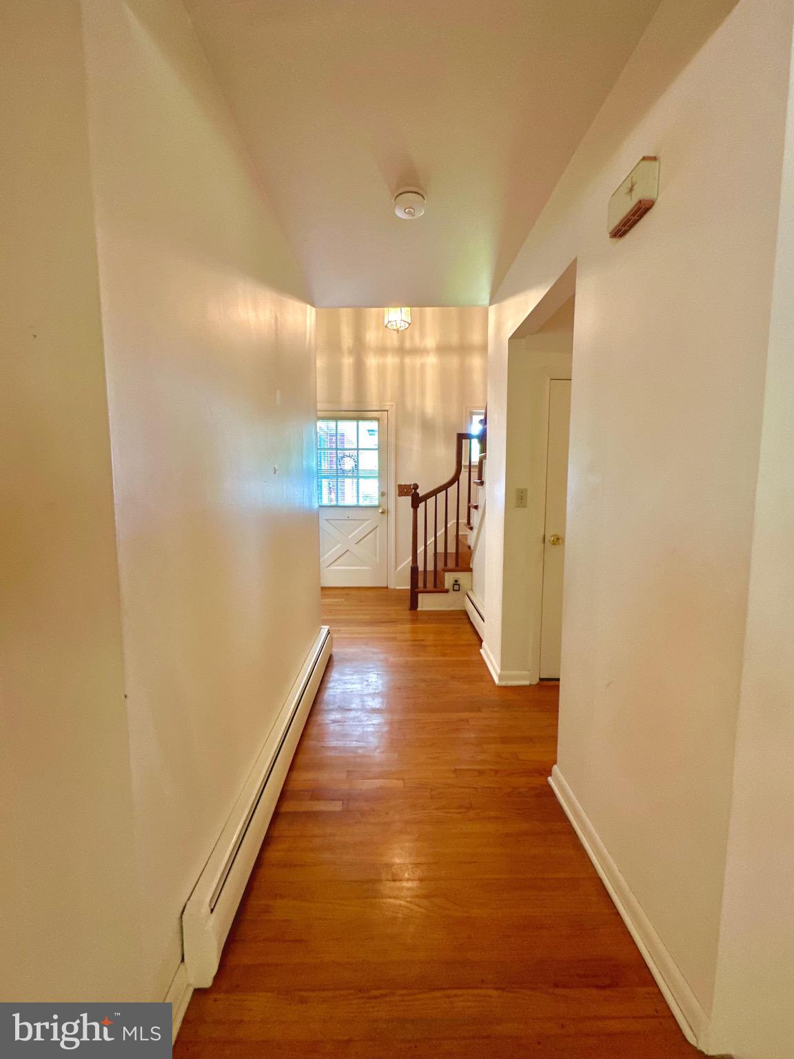 116 Main Street Townsend, DE 19734 - Photo 31 of 68 a view of a hallway with wooden floor