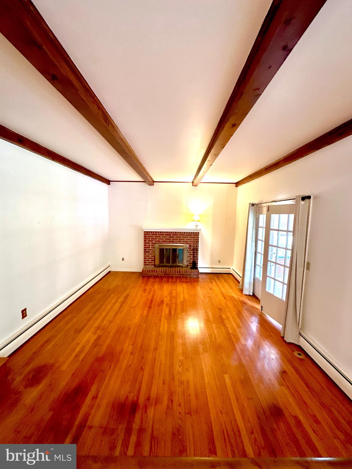 116 Main Street Townsend, DE 19734 - Photo 32 of 68 a view of empty room with wooden floor