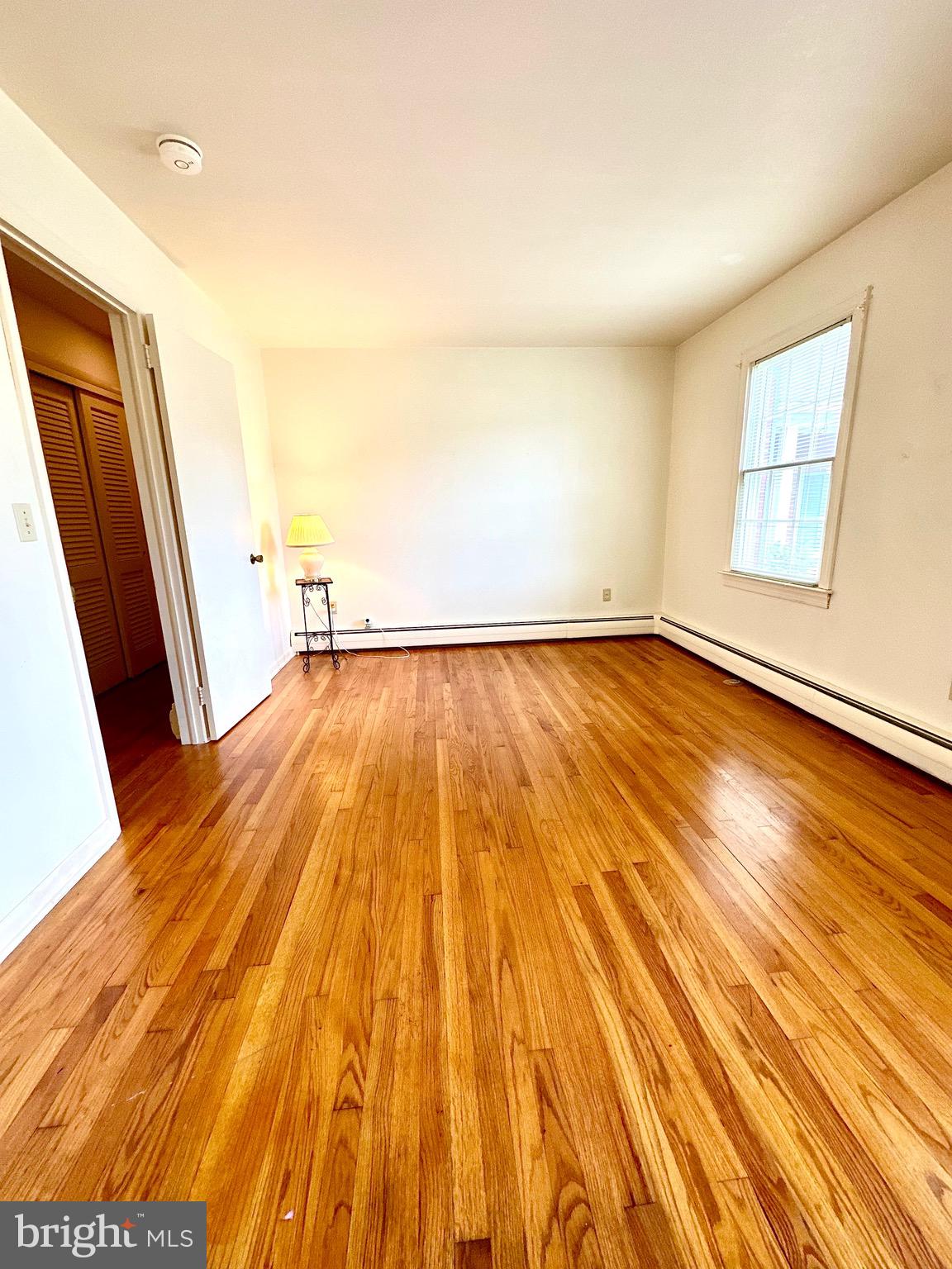 116 Main Street Townsend, DE 19734 - Photo 41 of 68 a view of an empty room with wooden floor and a window