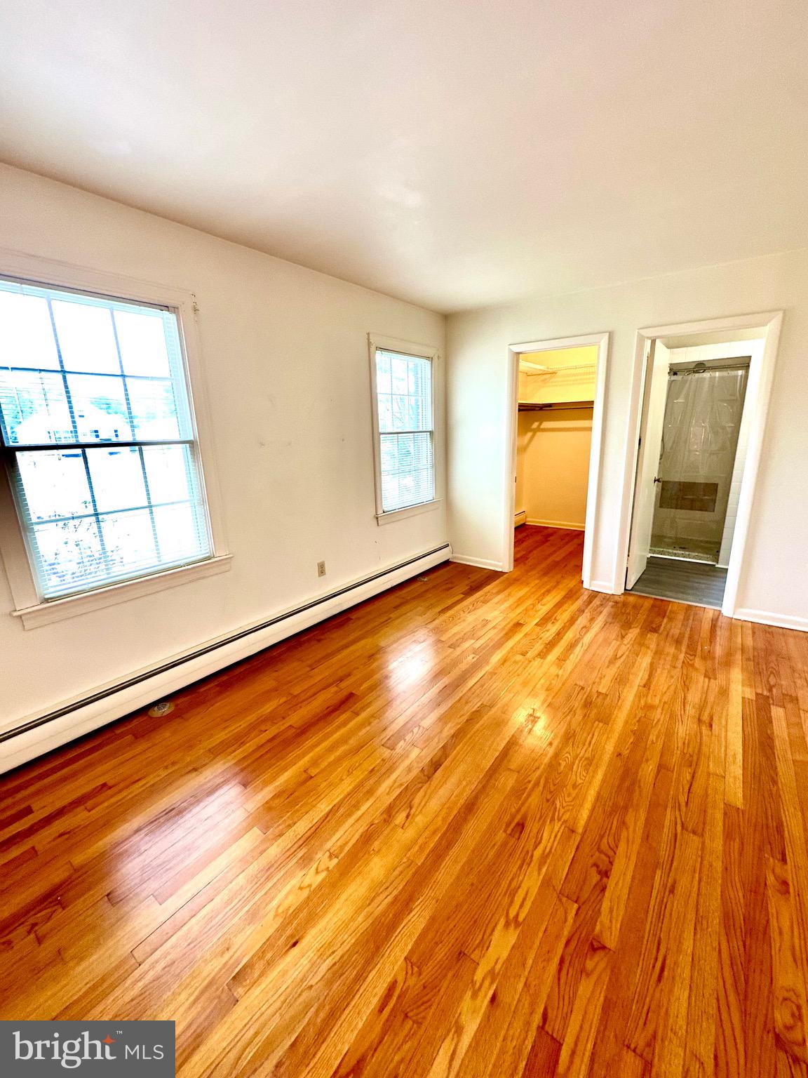 116 Main Street Townsend, DE 19734 - Photo 44 of 68 a view of an empty room with wooden floor and a window