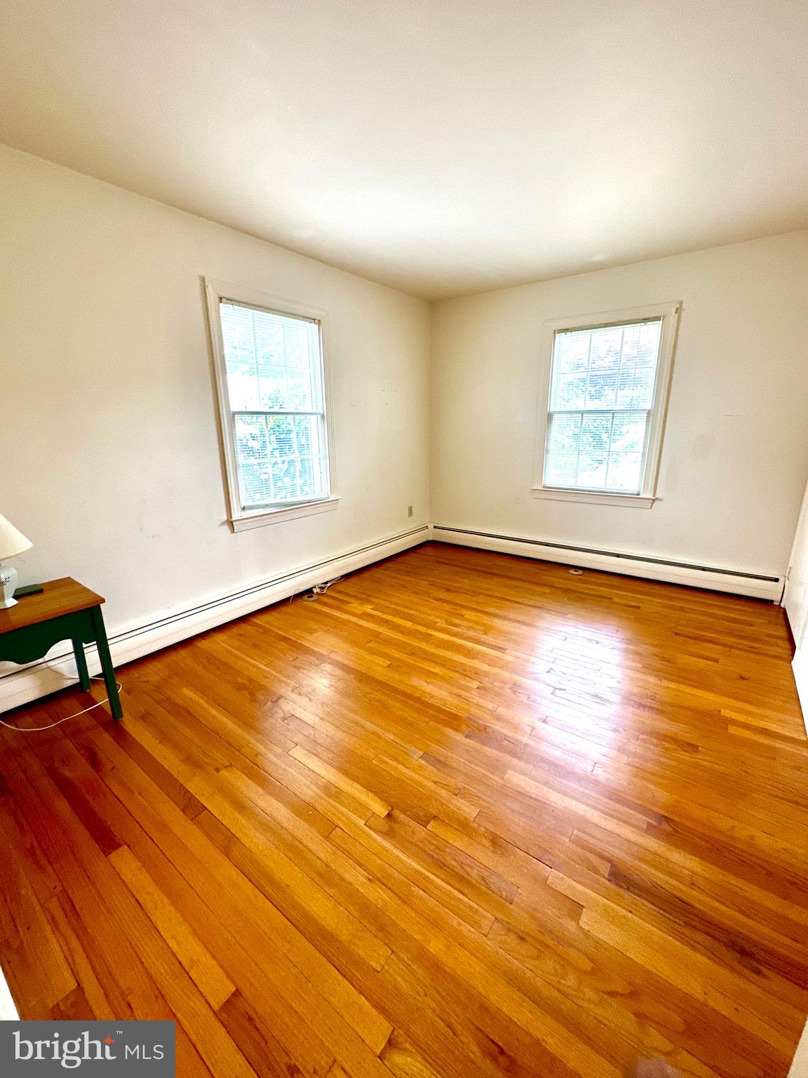 116 Main Street Townsend, DE 19734 - Photo 47 of 68 a view of an empty room with wooden floor and a window