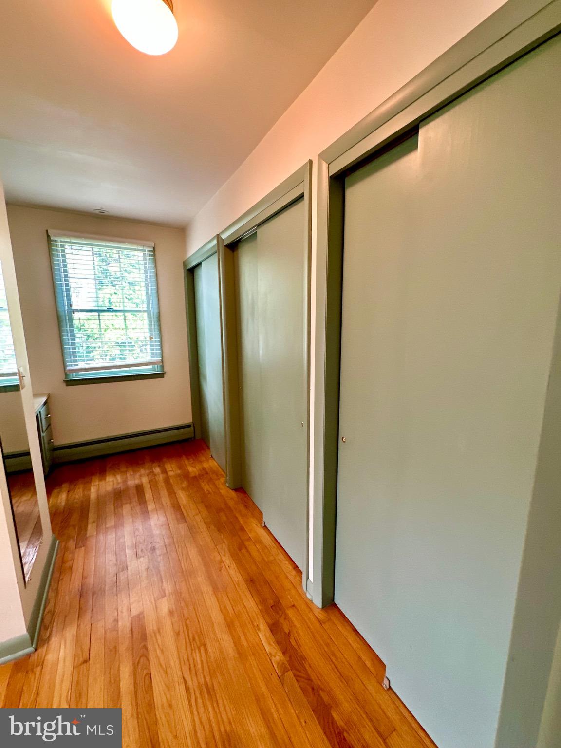 116 Main Street Townsend, DE 19734 - Photo 49 of 68 a view of an empty room with wooden floor and a window