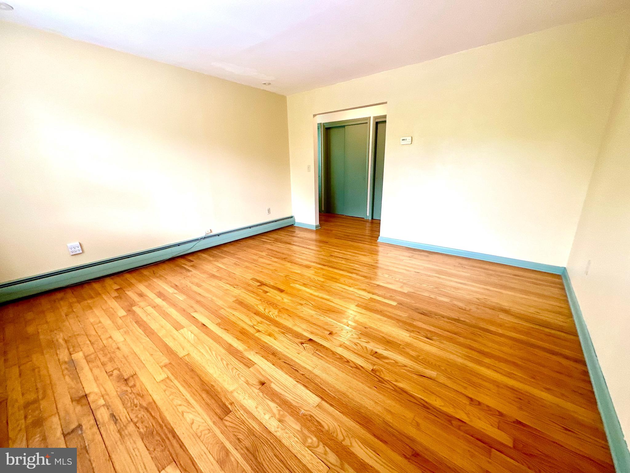 116 Main Street Townsend, DE 19734 - Photo 51 of 68 a view of an empty room with wooden floor
