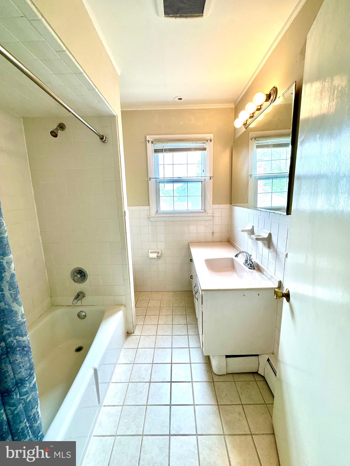 116 Main Street Townsend, DE 19734 - Photo 56 of 68 a bathroom with a sink mirror toilet shower and bathtub