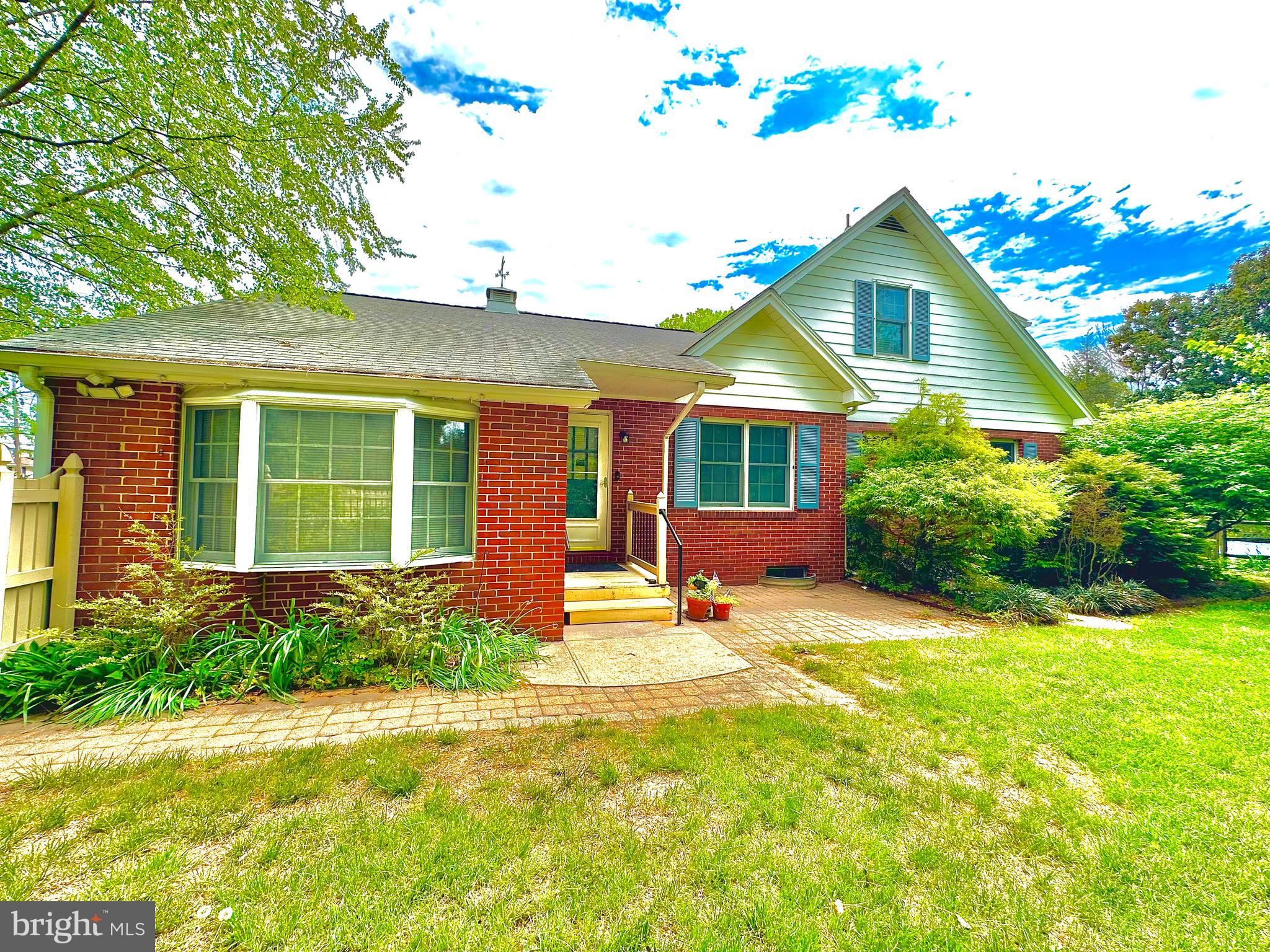 116 Main Street Townsend, DE 19734 - Photo 8 of 68 a front view of a house with a yard and potted plants
