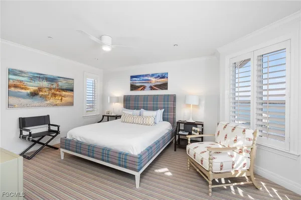 a bedroom with a bed and a desk