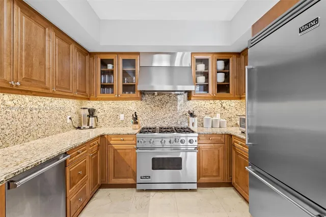 a kitchen with a stove top oven sink and cabinets