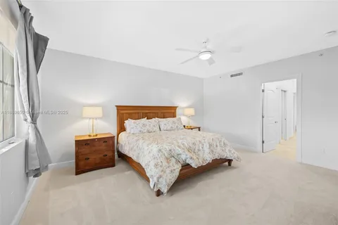 a bedroom with a bed and a lamp