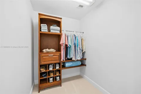 a room with a wooden floor and a window
