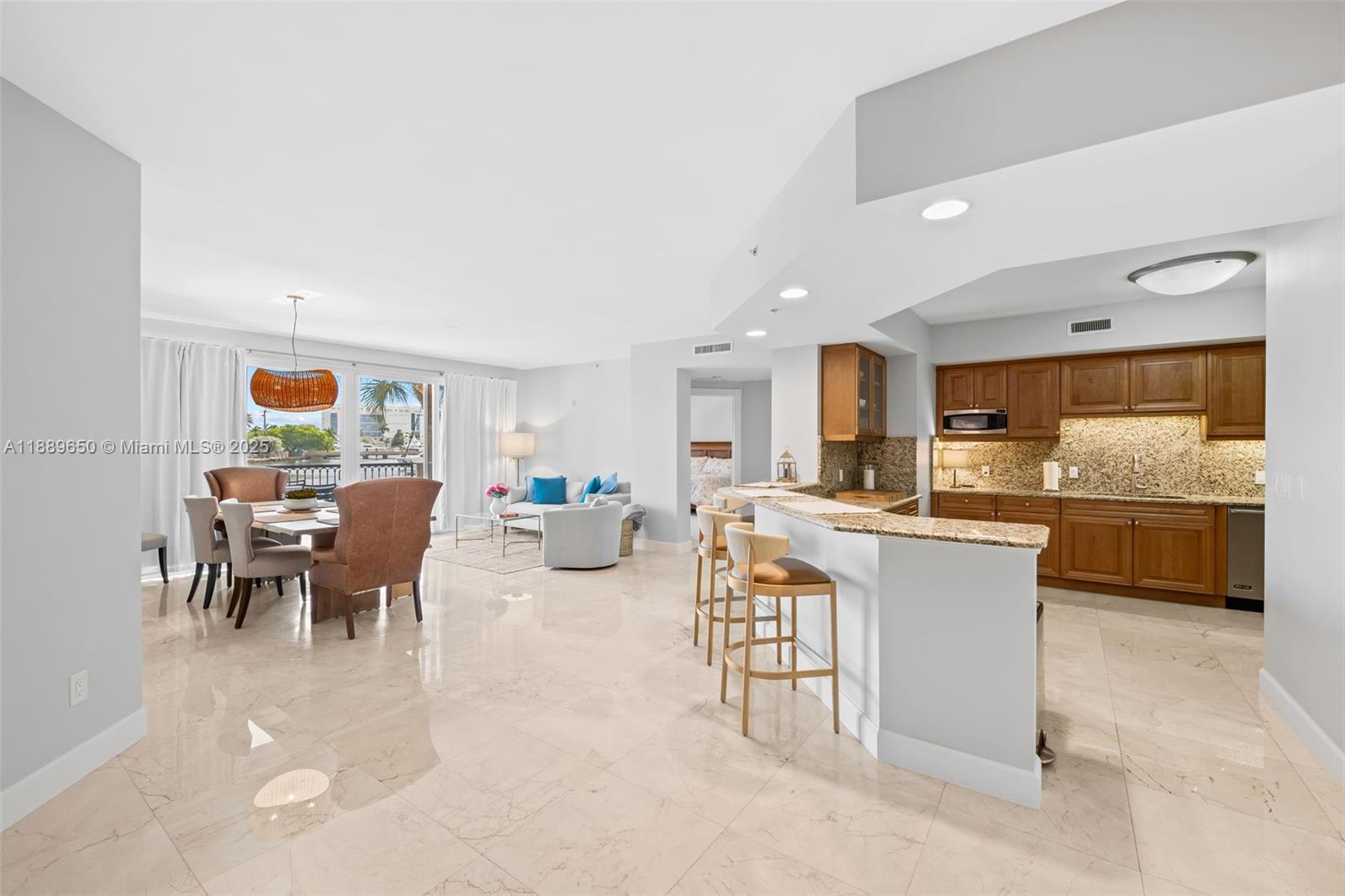 1414 Southeast 12th Street, Unit 1B Fort Lauderdale, FL 33316 - Photo 6 of 34 a living room with stainless steel appliances kitchen island granite countertop furniture and a kitchen view