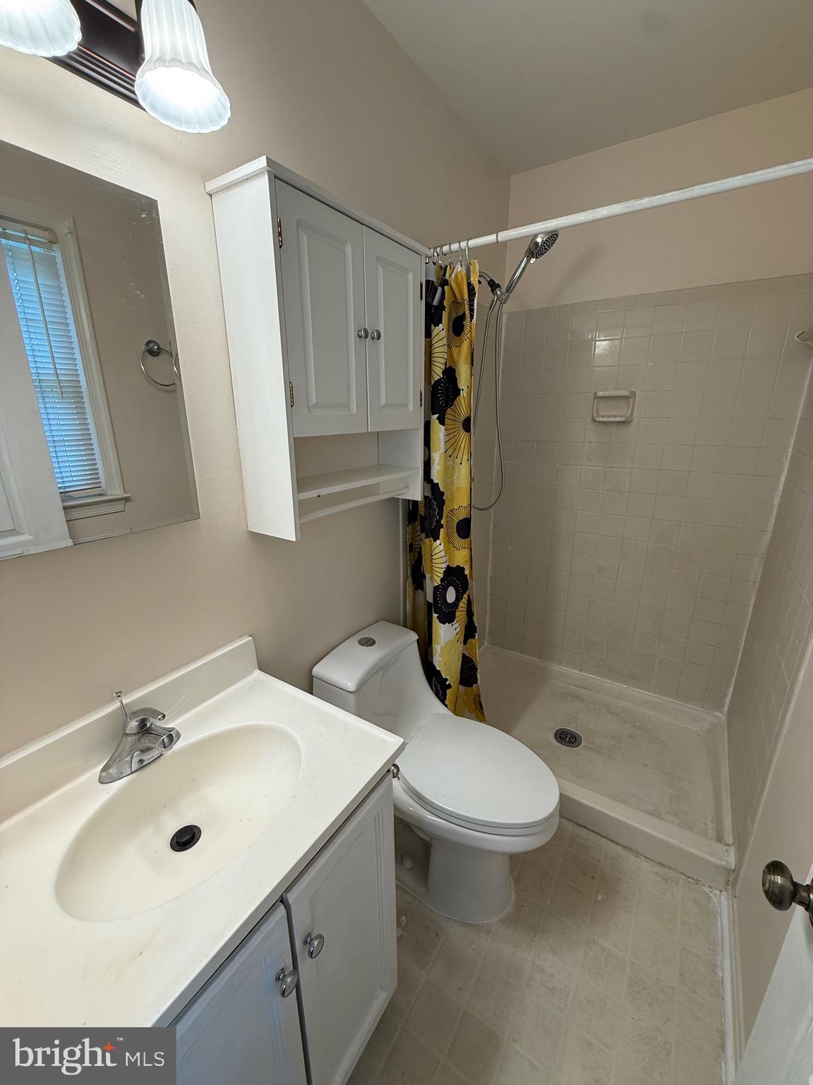 11724 Roosevelt Road Fredericksburg, VA 22407 - Photo 11 of 20 a bathroom with a sink toilet and shower
