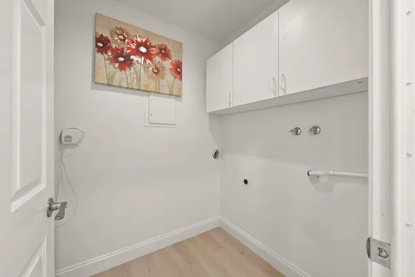 a view of a hallway with racks on the wall