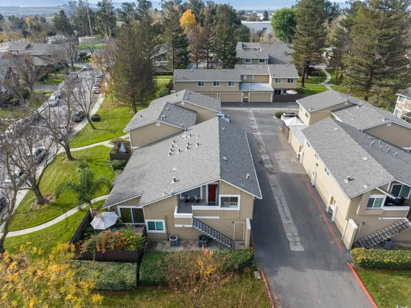 an aerial view of residential houses with outdoor space