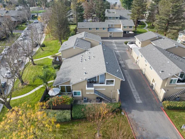 an aerial view of a house with a garden