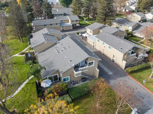 an aerial view of a house with outdoor space