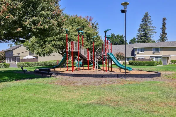 a park with lots of swings and slides