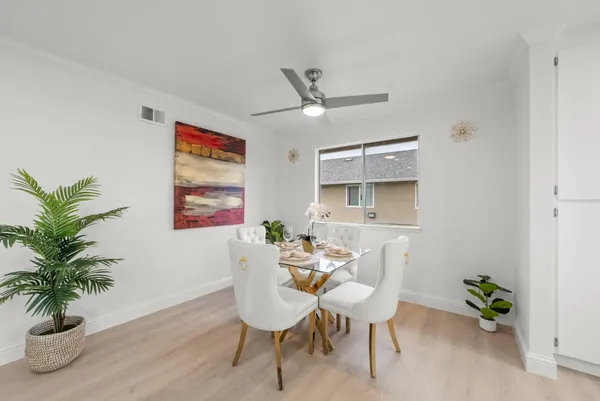 a dining room with furniture and window
