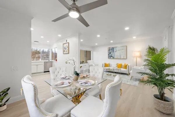 a living room with furniture and a potted plant