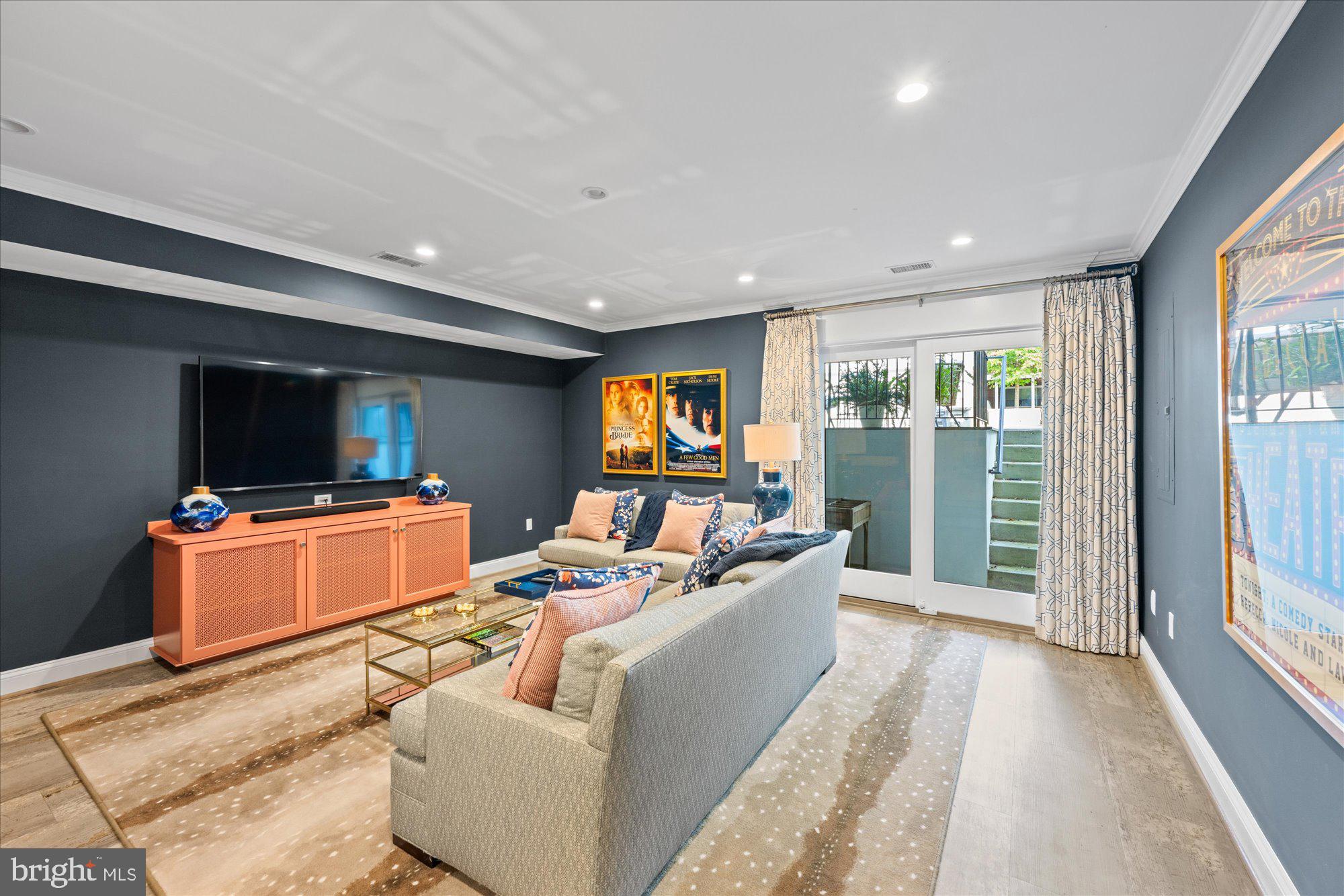 3723 Reservoir Road Northwest Washington, DC 20007 - Photo 15 of 45 a living room with furniture and a flat screen tv