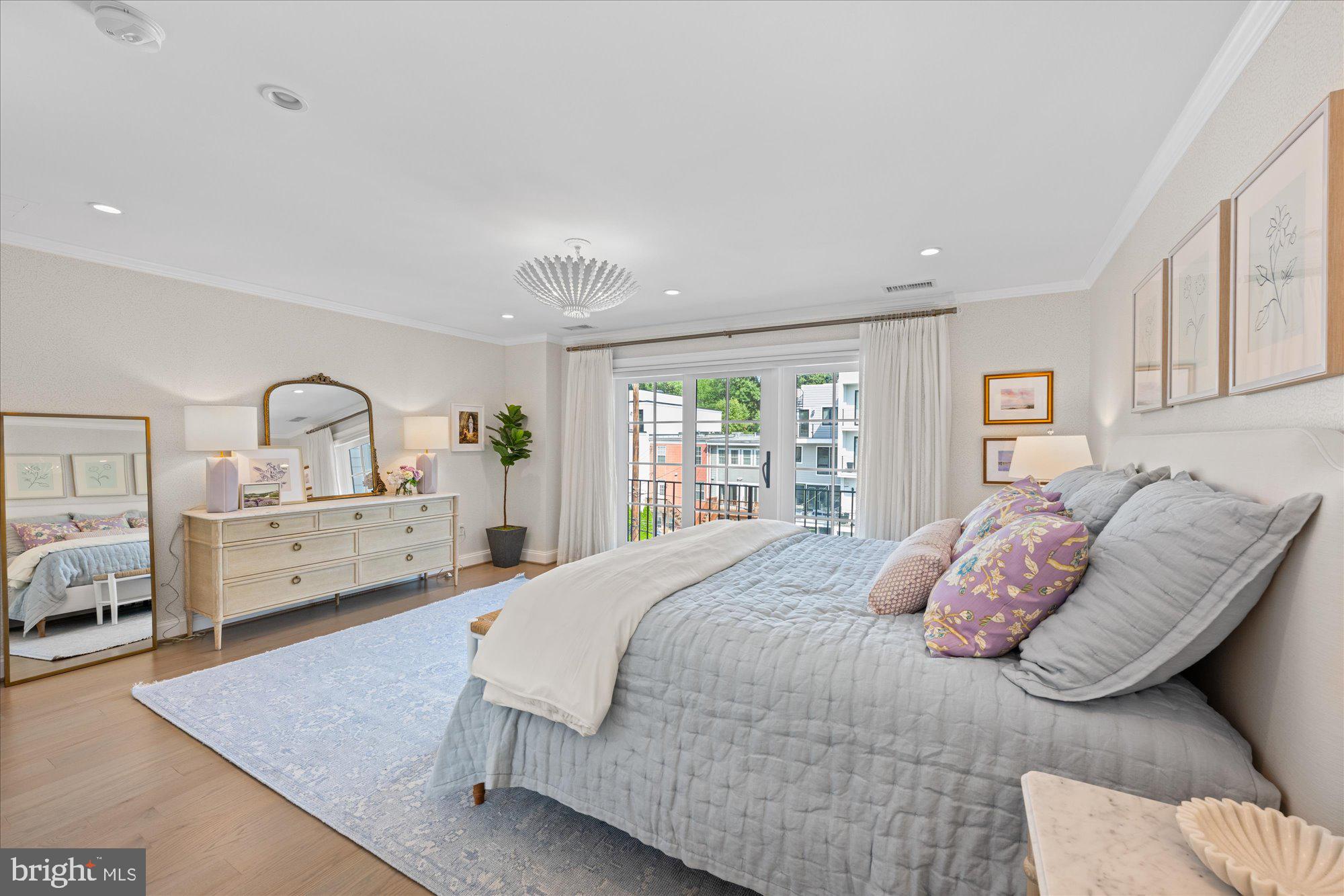 3723 Reservoir Road Northwest Washington, DC 20007 - Photo 19 of 45 a bedroom with a large bed and a large window