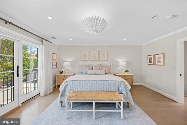 a bedroom with a bed and a chair