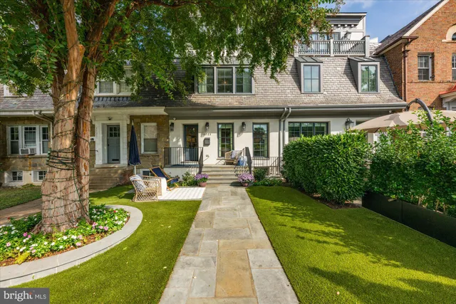 a front view of a house with garden