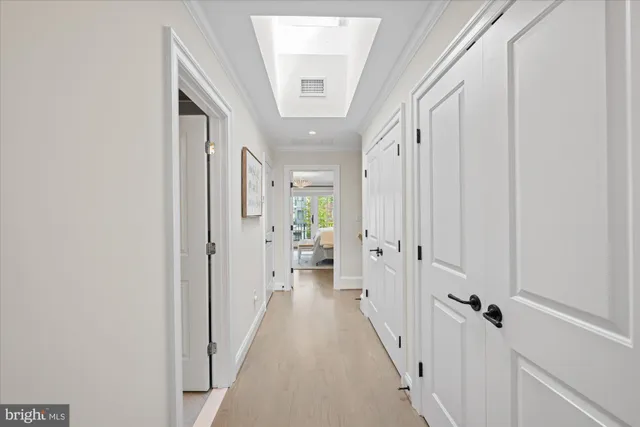 a view of a hallway with a wooden floors