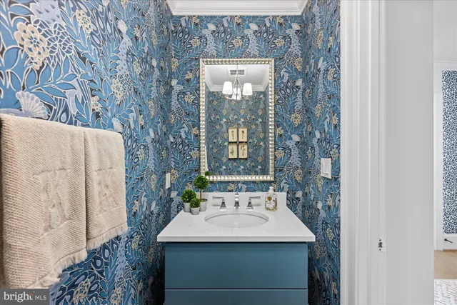 a bathroom with a sink and mirror