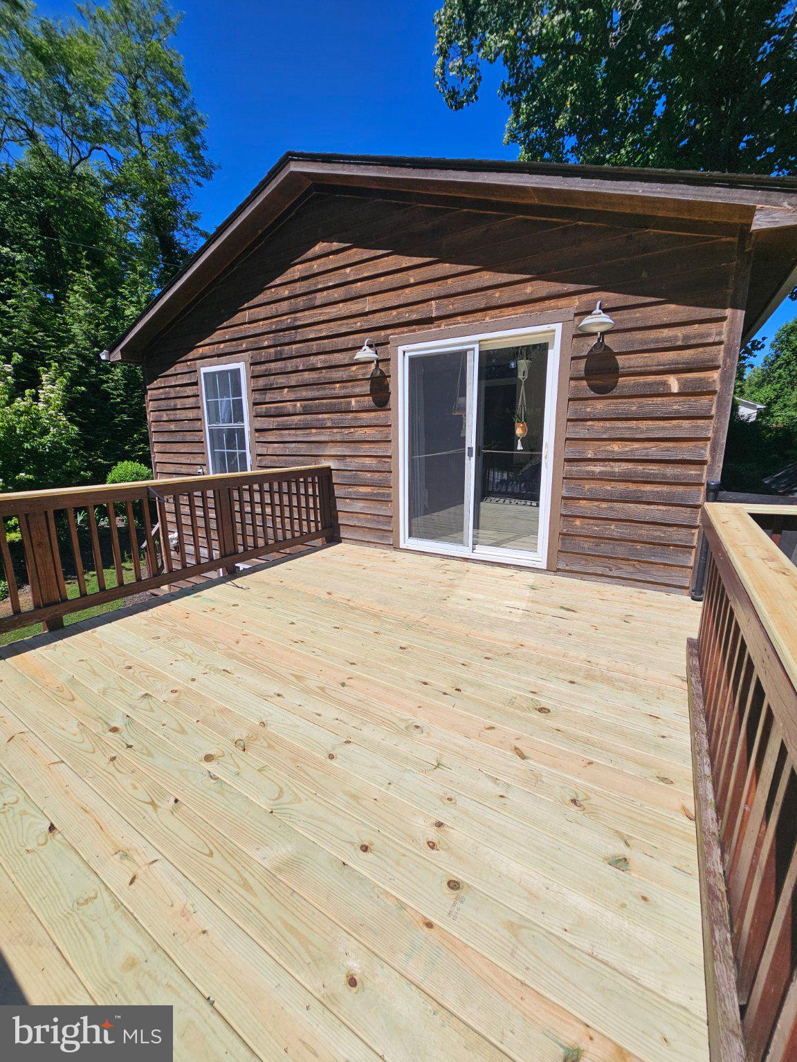 32 Parnassus Road Linden, VA 22642 - Photo 29 of 50 Charming wooden deck under blue skies.