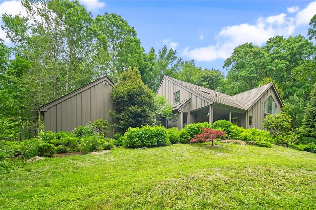 26 Patterson Road Pound Ridge, NY 10576 - Photo 1 of 1 a front view of house with garden and trees