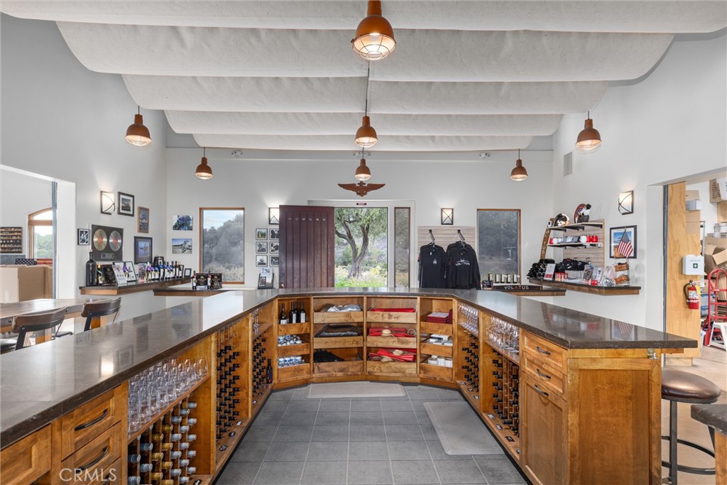 3000 Oakdale Road Paso Robles, CA 93446 - Photo 2 of 26 a large kitchen with kitchen island a large counter space wooden floor and stainless steel appliances