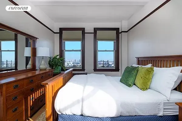 a living room with a bed and furniture