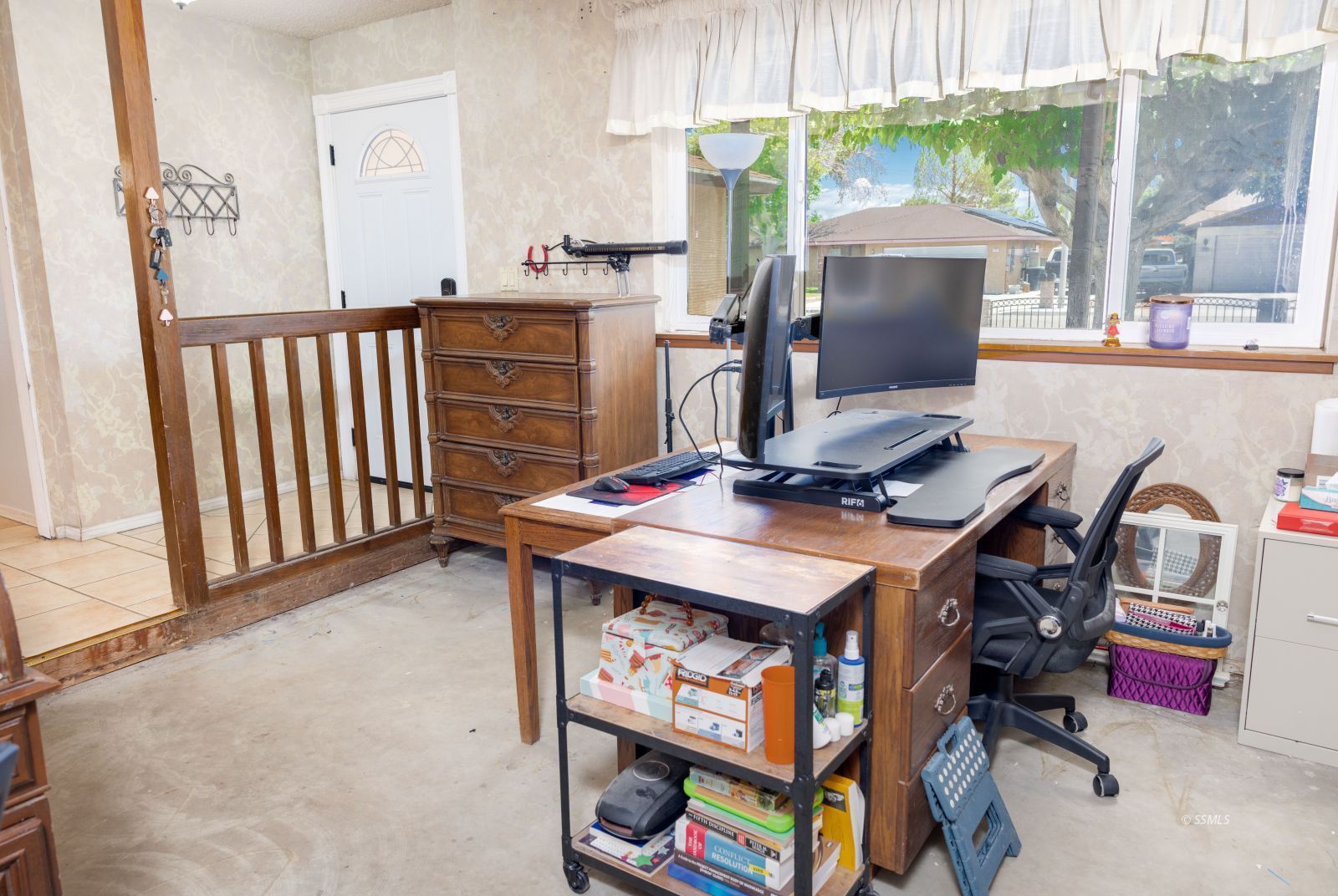 313 Larkspur Street Ridgecrest, CA 93555 - Photo 7 of 31 a room with furniture and a chandelier
